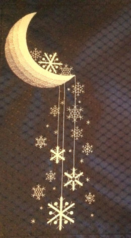 Starry snowflakes on dark blue table mat