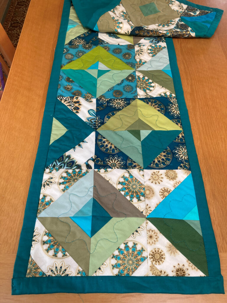 Sage table runner with mosaic and teal