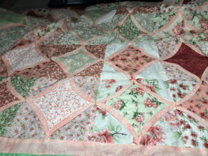 Coral Cathedral Shoofly quilt before shipping to MSQC. Shows some of the cathedral blocks.